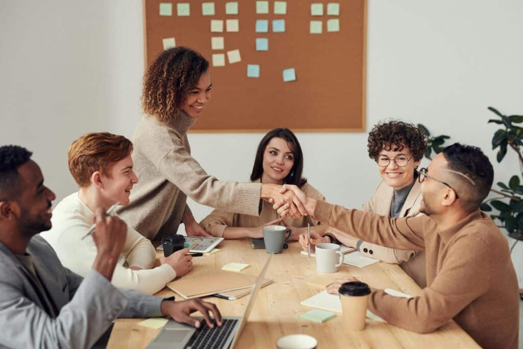 how to keep your job during downsizing can mean making connections at meetings with other employees from other corporate dpeartments