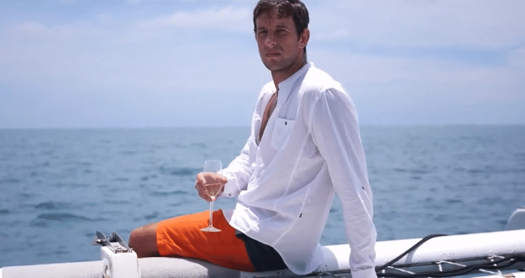 Narcissist on yacht drinking champagne
