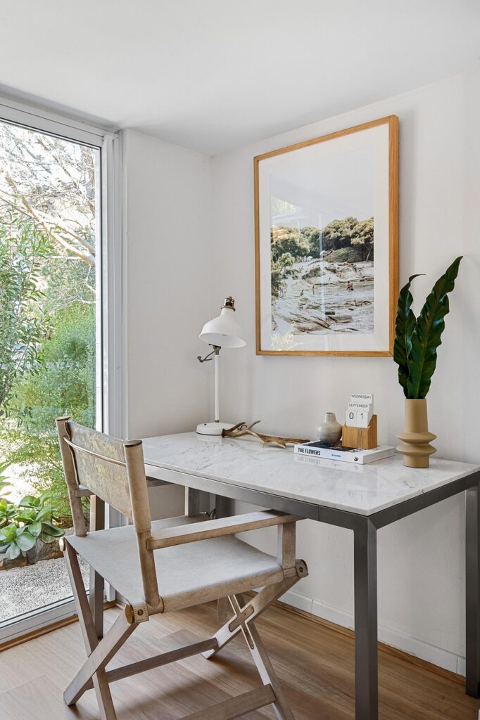 calm light room In Alberta with desk and window nature all ready for an online therapy in Alberta counselling session
